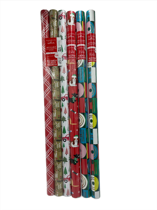 Holiday Wrapping Paper, Assorted. 15-25 rolls.